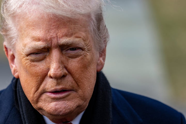 President Donald Trump speaks with reporters before departing on Marine One from the South Lawn of the White House, Friday, Jan. 16, 2026, in Washington. (AP Photo/Alex Brandon)
