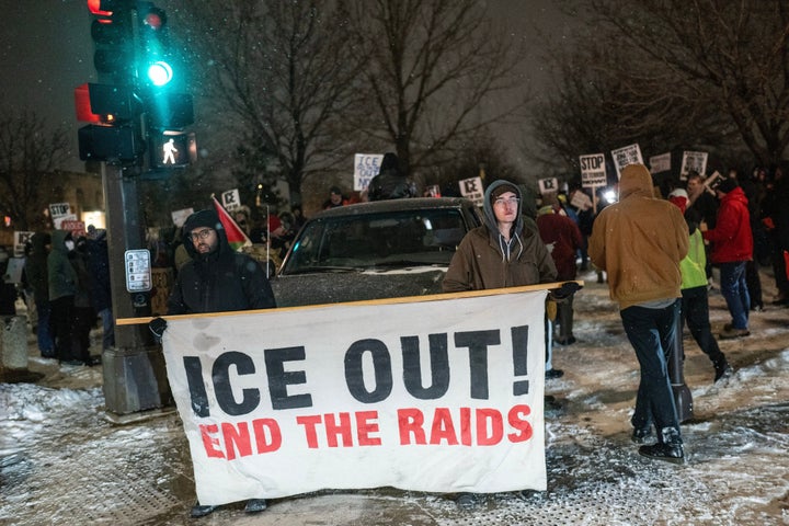 Demonstrators against the Immigration and Customs Enforcement (ICE) deployment in St. Paul, Minnesota, US, on Friday, Jan. 16, 2026. President Donald Trump threatened to deploy US military forces to Minnesota in order to quell protests in response to violent encounters involving federal immigration agents. Photographer: Victor J. Blue/Bloomberg via Getty Images