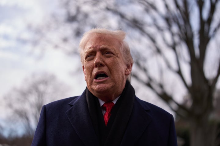 President Donald Trump speaks with reporters before boarding Marine One on the South Lawn of the White House, Friday, Jan. 16, 2026, in Washington. (AP Photo/Evan Vucci)