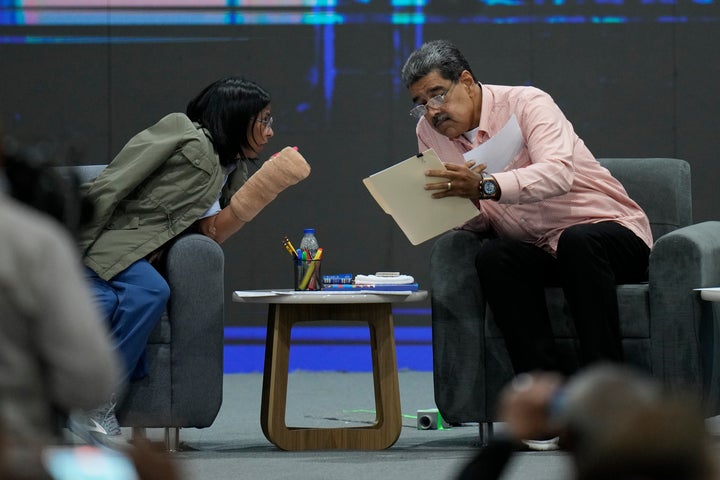 Venezuelan President Nicolas Maduro, right, talks with Vice President Delcy Rodriguez during a meeting with international observers in Caracas, Venezuela, Saturday, July 27, 2024.