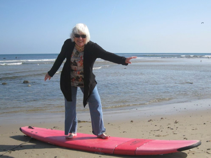 Mary Therese pretending to surf at Mission Beach in San Diego in 2010.