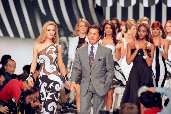FILE - Italian fashion designer Valentino Garavani walks the catwalk with his models after a fashion show on October 20, 1991 in Paris, France. (AP Photo/Remy de la Mauviniere, File)