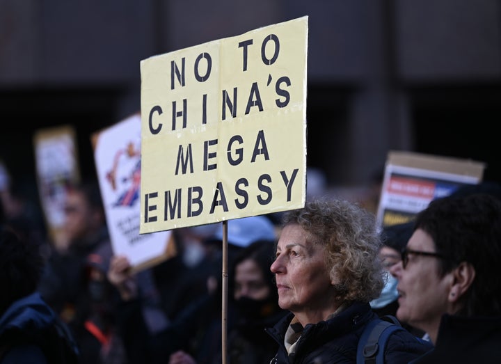 Demonstrators, holding banners, gather outside the Royal Mint Court to protest against plans to open new Chinese mega-embassy, which would create one of the largest embassies in the world and has been surrounded by national security concerns in London, United Kingdom on January 17, 2026.