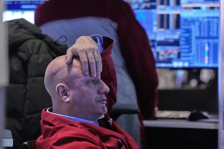 Trader John Mauro works on the floor of the New York Stock Exchange, Tuesday, Jan. 20, 2026. (AP Photo/Richard Drew)