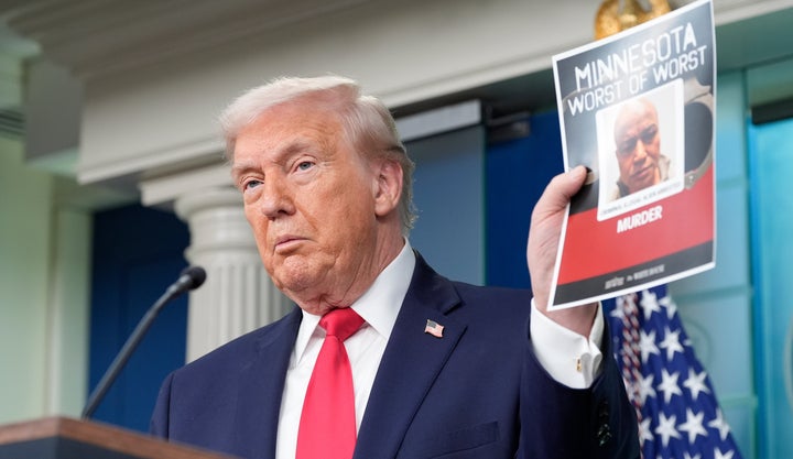 Trump appeared at the White House press briefing on Tuesday and held up photos of some of the people ICE has allegedly arrested in Minnesota.