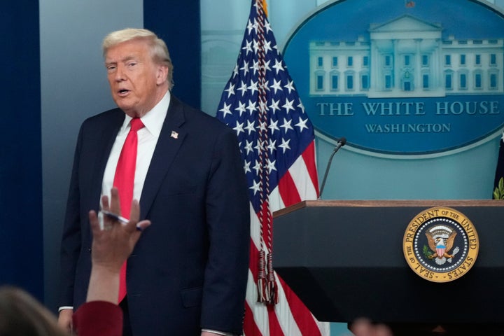 President Donald Trump leaves after speaking at a press conference at the White House in Washington, Tuesday, Jan. 20, 2026. (AP Photo/Mark Schiefelbein)