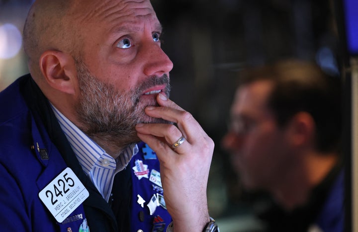 A trader works on the floor of the New York Stock Exchange (NYSE) in New York on January 20, 2026. (Photo by TIMOTHY A. CLARY / AFP via Getty Images)
