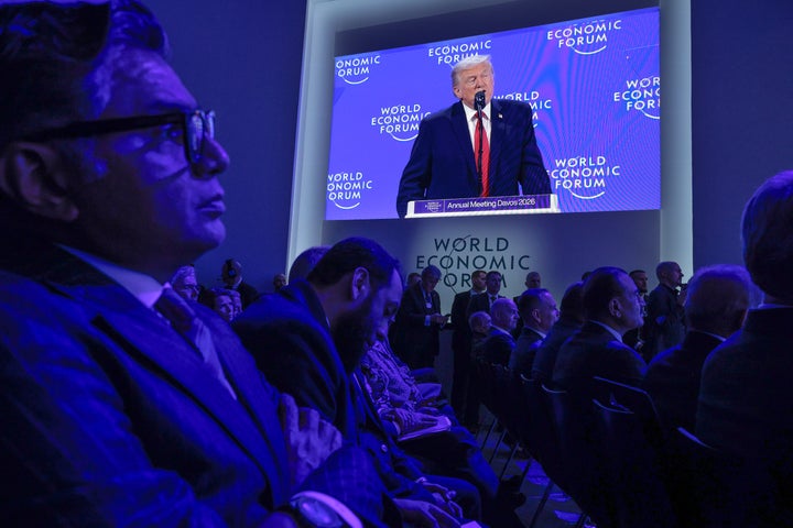 DAVOS, SWITZERLAND - JANUARY 21: U.S. President Donald Trump appears on a large screen as he addresses the World Economic Forum (WEF) in the Davos Congress Center on January 21, 2026 in Davos, Switzerland. (Photo by Chip Somodevilla/Getty Images)