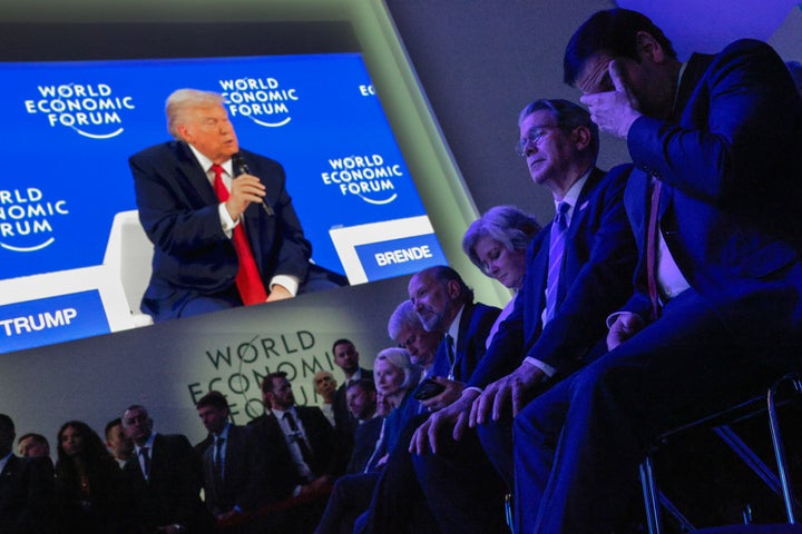 DAVOS, SWITZERLAND - JANUARY 21: Members of President Donald Trump's cabinet, including Energy Secretary Chris Wright, Commerce Secretary Howard Lutnik, Chief of Staff Susie Wiles, Treasury Secretary Scott Bessent and Secretary of State Marco Rubio, listen to Trump address the World Economic Forum (WEF) in the Davos Congress Center on January 21, 2026 in Davos, Switzerland. (Photo by Chip Somodevilla/Getty Images)