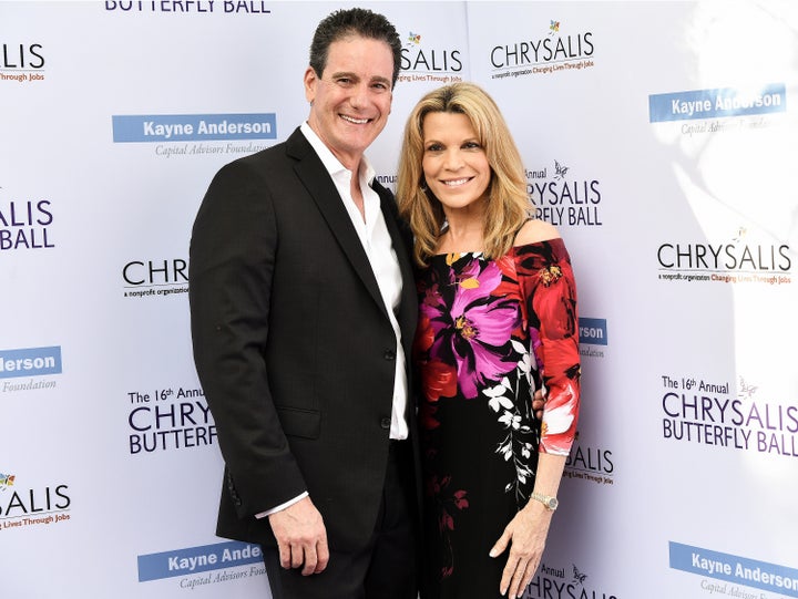 John Donaldson and Vanna White, pictured in an archival photograph, marked their marriage with an image of Donaldson carrying White across the threshold.