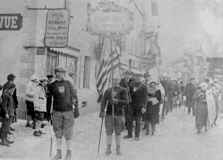 The United States delegation during the opening ceremony of the 1924 Winter Olympics in Chamonix, France. Teams from all nations paraded from City Hall to the skating rink, where the competitions proper began the next day.
