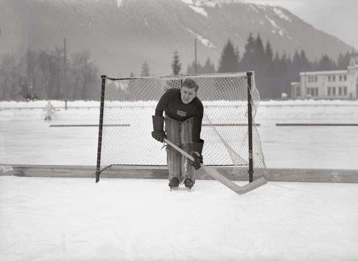 American ice hockey goalie Alphonse Lacroix during practice, before winning a silver medal with the team.