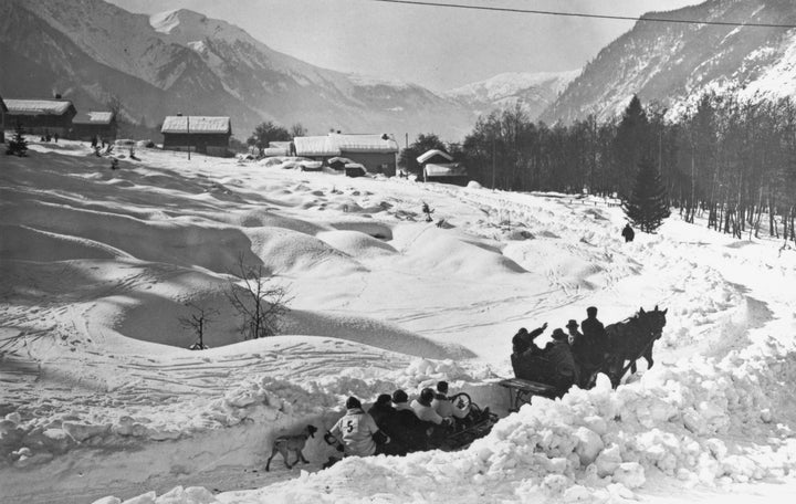 Competitors are taken to the starting point of the bobsleigh event.