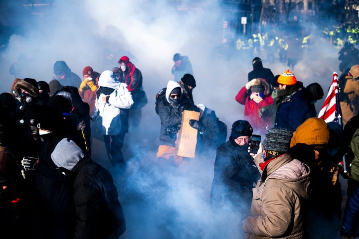 Demonstrators in Minneapolis on Saturday, enveloped by tear gas thrown by law enforcement.