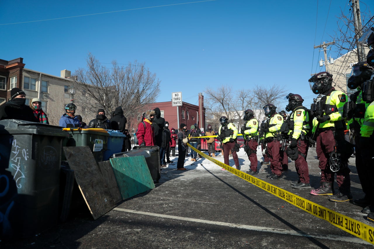 Protesters face off with police following the killing of Pretti.