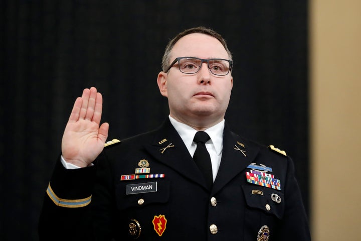 In this Nov. 19, 2019, file photo National Security Council aide Lt. Col. Alexander Vindman is sworn in to testify before the House Intelligence Committee on Capitol Hill in Washington during a public impeachment hearing of President Donald Trump's efforts to tie U.S. aid for Ukraine to investigations of his political opponents. Vindman was escorted out of the White House complex on Feb. 7, 2020, according to his lawyer.