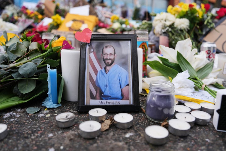 A photo of 37-year-old Alex Pretti, who was fatally shot by two federal over the weekend, is displayed at the shooting scene on Jan. 26, 2026, in Minneapolis.