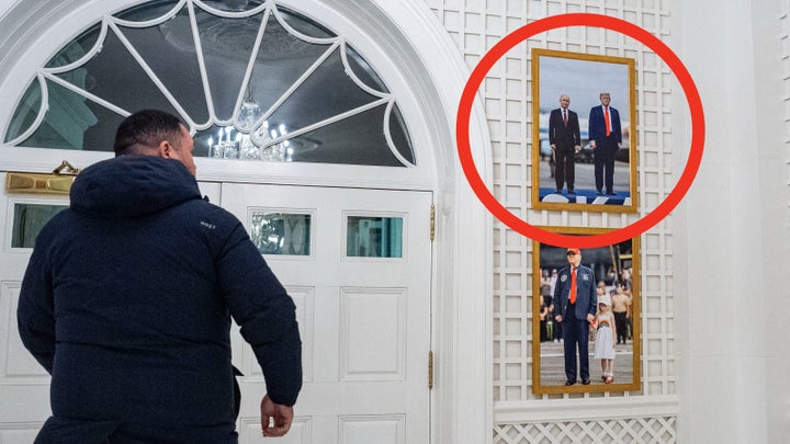 Photographs showing U.S. President Donald Trump with Russian President Vladimir Putin and President Trump and one of his grandchildren hang in the Palm Room of the White House in Washington, D.C., on Tuesday, Jan. 27, 2026.