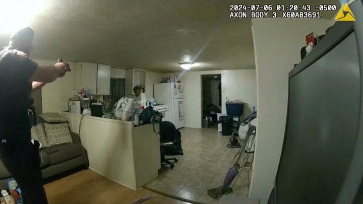 In this image taken from body camera video released by Illinois State Police on Monday, July 22, 2024, former Sangamon County Sheriff's Deputy Sean Grayson, left, points his gun at Sonya Massey, who called 911 for help, before shooting and killing her inside her home in Springfield, Ill., July 6, 2024. (Illinois State Police via AP, File)