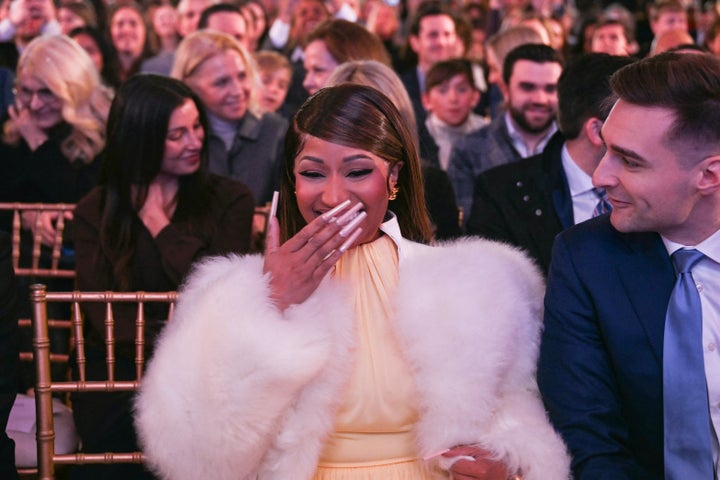 Nicki Minaj laughs in the audience as President Donald Trump speaks onstage Wednesday at the Andrew W. Mellon Auditorium in Washington, D.C.
