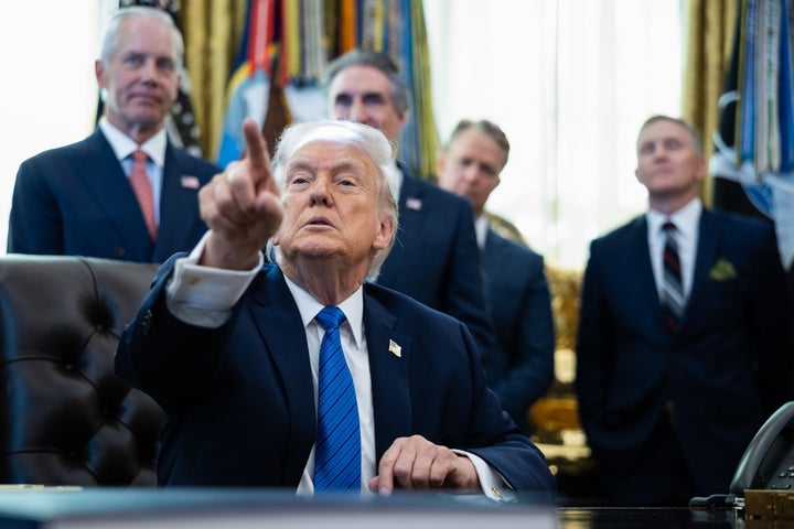 US President Donald Trump, second left, speaks during an executive order signing in the Oval Office of the White House in Washington, DC, US, on Friday, Jan. 30, 2026. Trump signed an executive order intended to launch an IndyCar race on the streets of Washington as part of a series of America250 celebrations. Photographer: Francis Chung/Politico/Bloomberg via Getty Images
