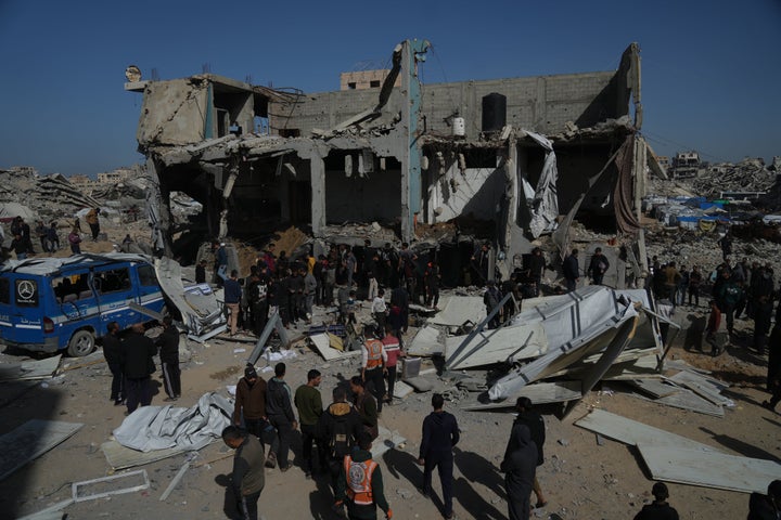 Palestinians search for bodies and survivors from the rubble of a police station after it was targeted by an Israeli army strike in Gaza City Saturday, Jan. 31, 2026. (AP Photo/Jehad Alshrafi)