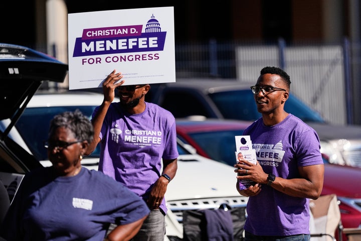 Democratic 18th Congressional District candidate Christian Menefee greets voters near a polling place on Tuesday, Nov. 4, 2025, in Houston. (AP Photo/Ashley Landis)