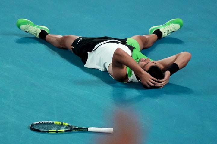 Carlos Alcaraz of Spain reacts after beating Novak Djokovic of Serbia in the men's singles final at the Australian Open tennis championship in Melbourne, Australia, Sunday, Feb. 1, 2026. (AP Photo/Mark Baker)