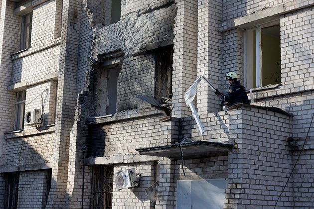 A rescue worker clears debris in a damaged maternity hospital following a Russian strike in Zaporizhzhia on Sunday.