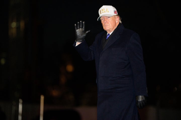 TOPSHOT - US President Donald Trump steps off Marine One on the South Lawn upon arrival at the White House in Washington, DC, on February 1, 2026. (Photo by Aaron Schwartz / AFP via Getty Images)