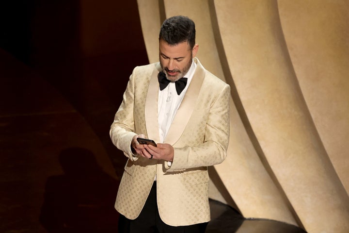 Jimmy Kimmel reads a message from Donald Trump during the 2024 Oscars. 
