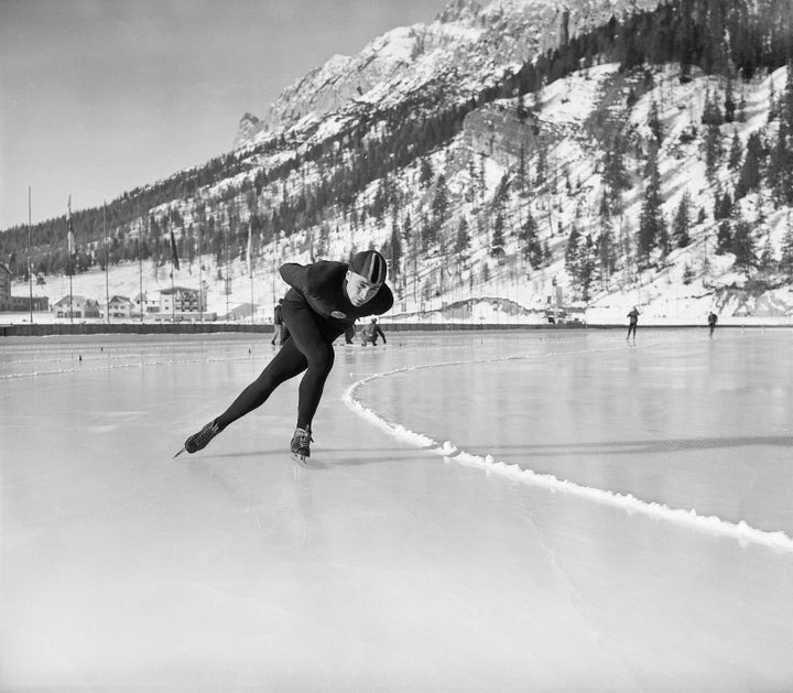 Russia’s Yevgeny Grishin winning the 500-meter speed skating.