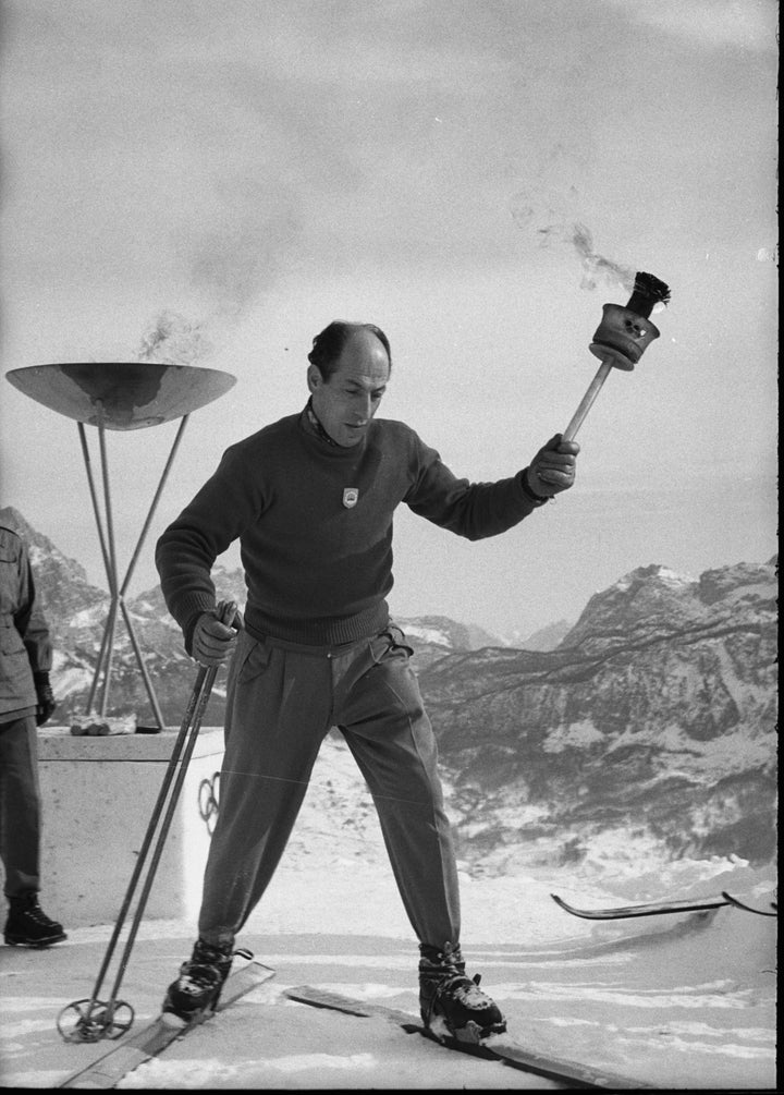 The lighting of a torch from the Olympic flame.