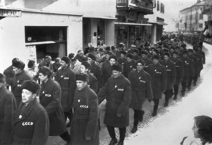 Soviet athletes parade through the streets of Cortina d'Ampezzo.
