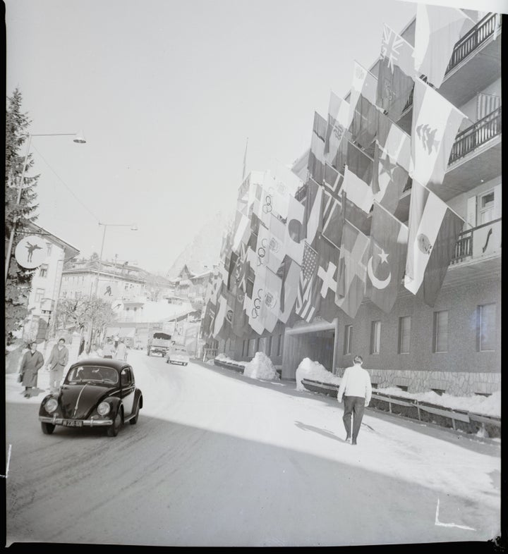 Array of national banners hung in front of the Olympics HQ.