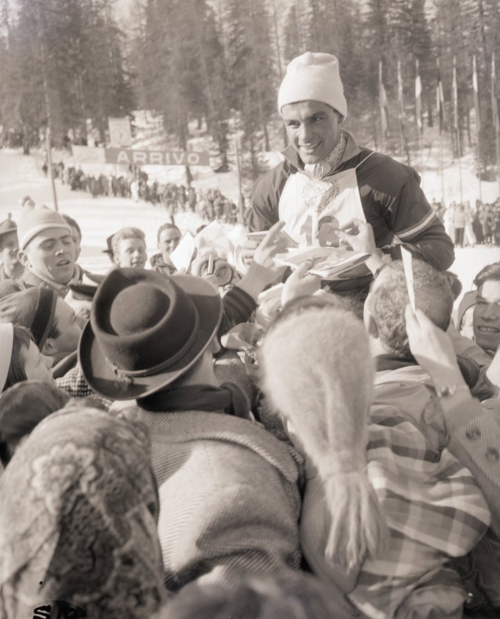 Austria’s Toni Sailer is carried on the shoulders of fans after winning the men’s giant slalom.