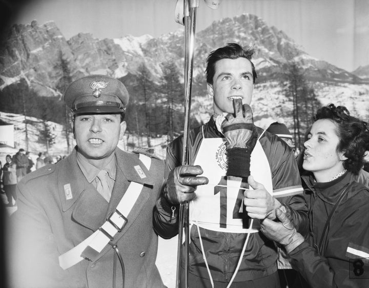 Austrian skier Toni Sailer, center, his sister Rosl, right, and a soldier, left, following his victory in the men’s downhill competition.