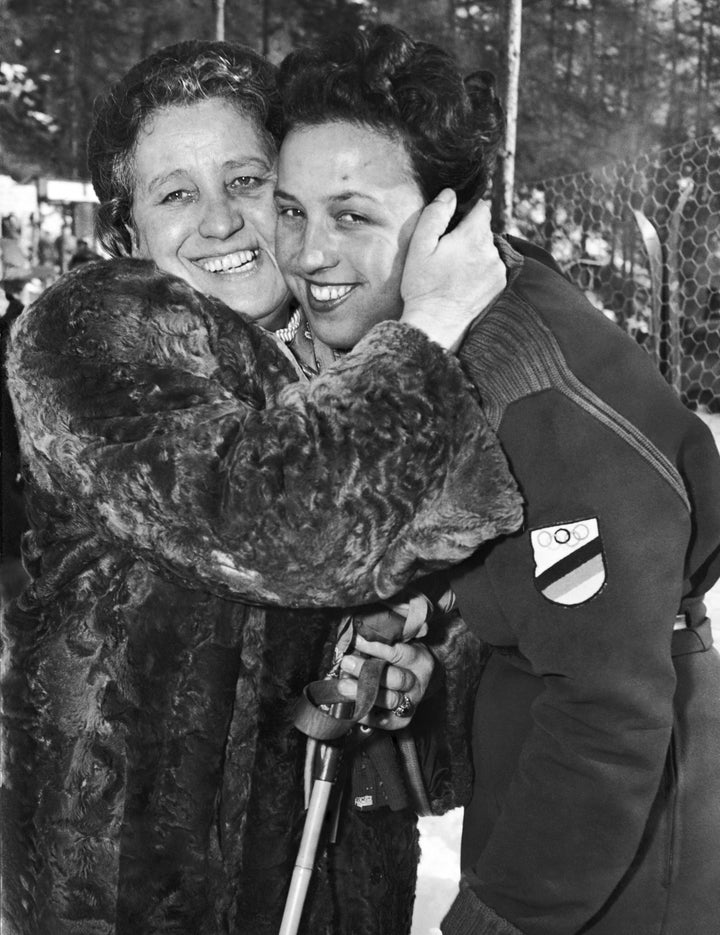 Ossi Reichert, right, is congratulated by her mother after winning the ladies’ giant slalom race.