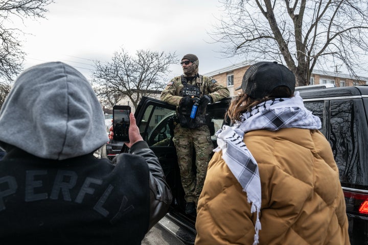 Demonstrators film a federal law enforcement agent in Minneapolis in January. Ideally, you would not be alone when you hit record, experts recommend.