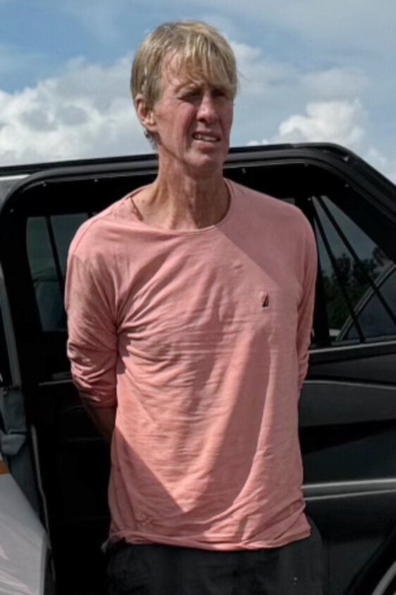 In this imaged released by the Martin County, Fla., Sheriff's Office, law enforcement officers arrest Ryan Routh, the man suspected in the apparent assassination attempt of Donald Trump, Sept. 15, 2024. (Martin County Sheriff's Office via AP, File)