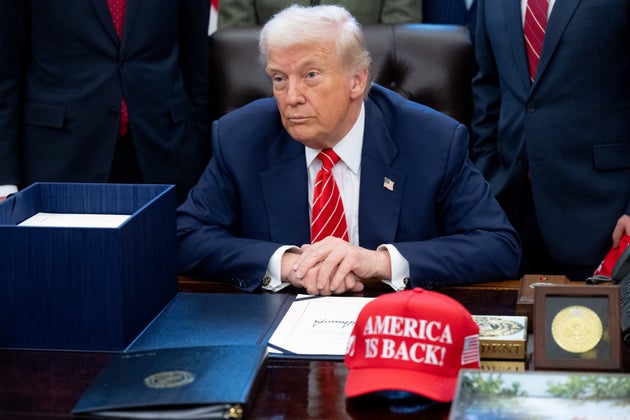US President Donald Trump speaks with the media after signing a funding bill to end a partial government shutdown in the Oval Office of the White House in Washington, DC, February 3, 2026.