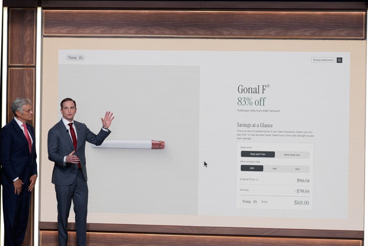 National Design Studio director Joe Gebbia and Centers for Medicare & Medicaid Services administrator Dr. Mehmet Oz talk about TrumpRx during an event with President Donald Trump in the South Court Auditorium in the Old Eisenhower Executive Office Building on the White House campus, Thursday, Feb. 5, 2026, in Washington. (AP Photo/Alex Brandon)