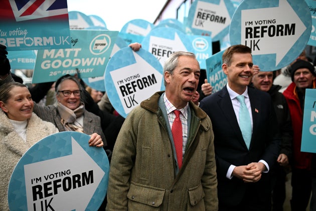 Reform UK candidate Matt Goodwin (R) and Reform UK leader Nigel Farage open the Gorton and Denton Reform UK campaign office, northwest England on February 5, 2026, ahead of the February 26 Gorton and Denton by-election.