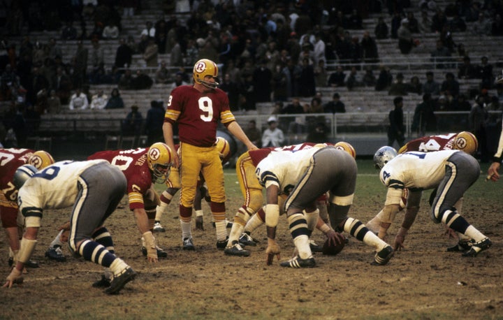 Hall of Fame quarterback Sonny Jurgensen (9) of the Washington Redskins calls signals during the Redskins' 13-0 loss to the Dallas Cowboys on November 21, 1971 at RFK Stadium in Washington, DC (Photo by Nate Fine/Getty Images)