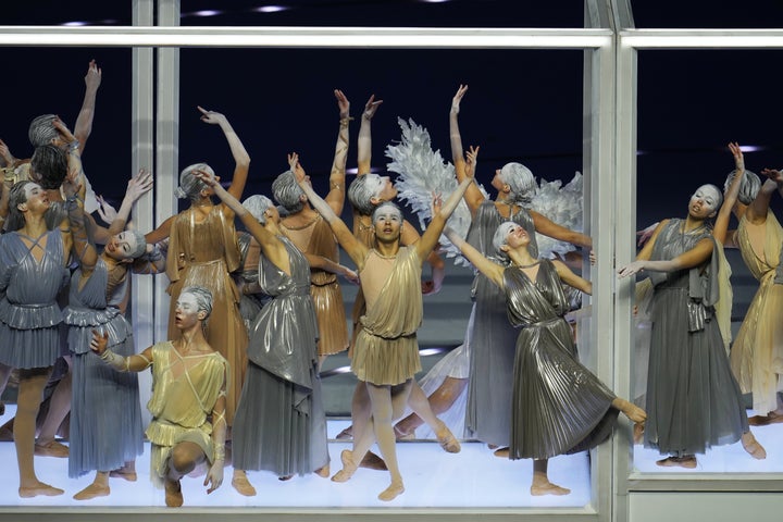 Performers take part in the Olympic opening ceremony of the 2026 Winter Olympics in Milan, Italy, Friday, Feb. 6, 2026. (AP Photo/Ben Curtis)