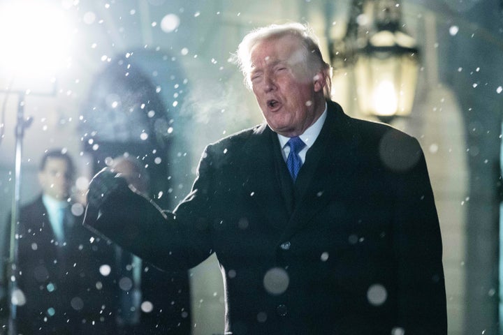 President Donald Trump speaks to reporters on the South Lawn before departing the White House, Friday, Feb. 6, 2026, in Washington. (AP Photo/Jose Luis Magana)