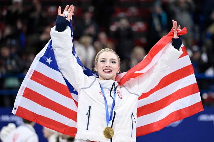 Gold medalist Amber Glenn following the podium ceremony of the figure skating team event.
