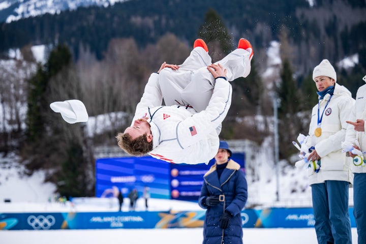 Silver medalist Ben Ogden performs a backflip off the podium during the medal ceremony on Monday.