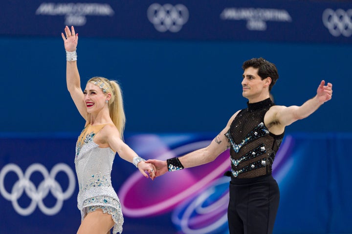 Piper Gilles and her partner Paul Poirier, without one of their wristbands, following their rhythmic dance routine.