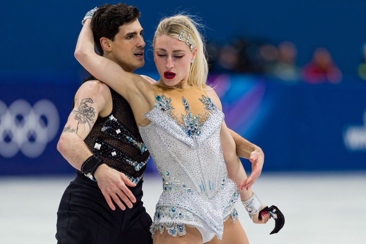 From left: Paul Poirier and Piper Gilles, who is seen holding her dance partner's wristband in her hand at the end of their routine.